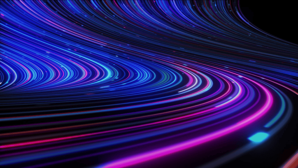 Abstract digital illustration of swirling blue and purple light trails.